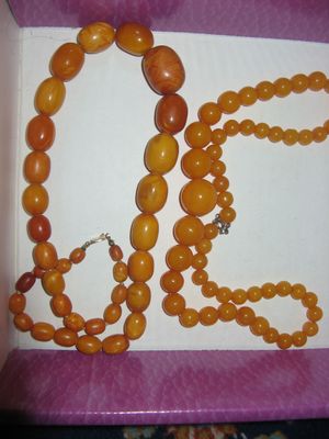 The necklace on the left is amber, the other one is Bakelite