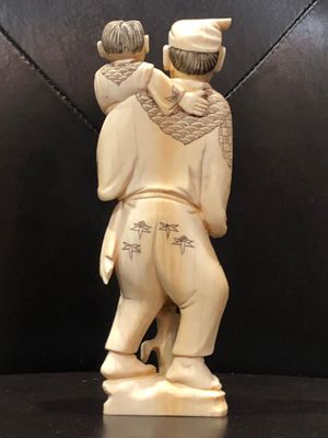 carved figurine back
