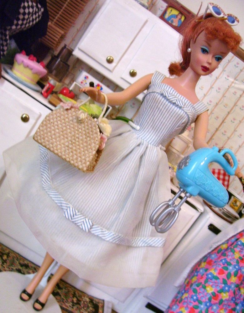 This dress and purse were yardsale finds as well.  Had to have the mixer.  So, here is Barbie torn between movies or staying home to bake, ha!