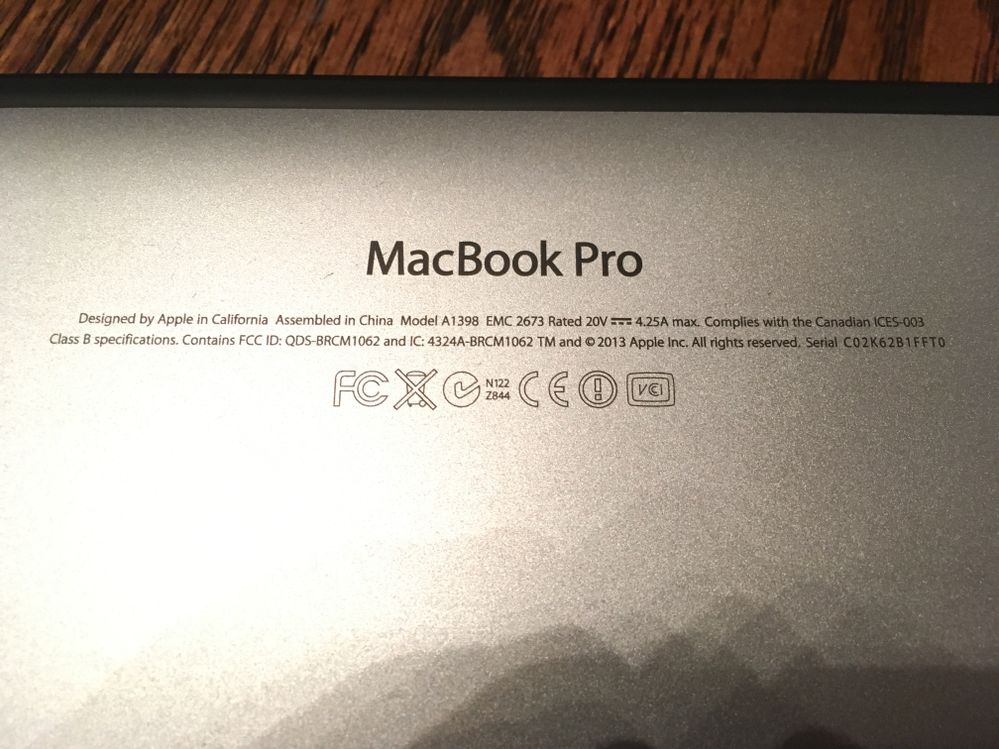 The bottom case serial, which doesn't match the auction and belongs to a much older model (2013 MacBook Pro). (image uploaded to dispute)