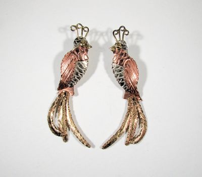 Artisan, mixed metal pierced earrings.  The tails are articulated at the top.
