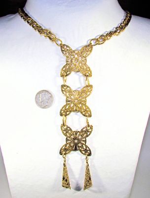 Vintage, older brass medallion ladder necklace.