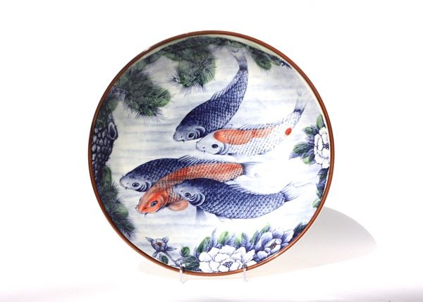 It is the same company that made this koi fish charger in Japan. Have a note that says Sun Ceramics but that may be the importer.