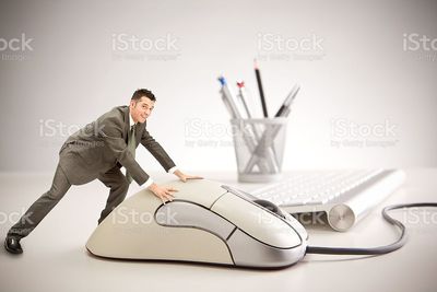 little-smiling-business-man-using-giant-mouse-at-work-picture-id157608249.jpg
