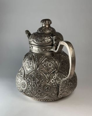 silver repousse teapot 3 copy.jpg