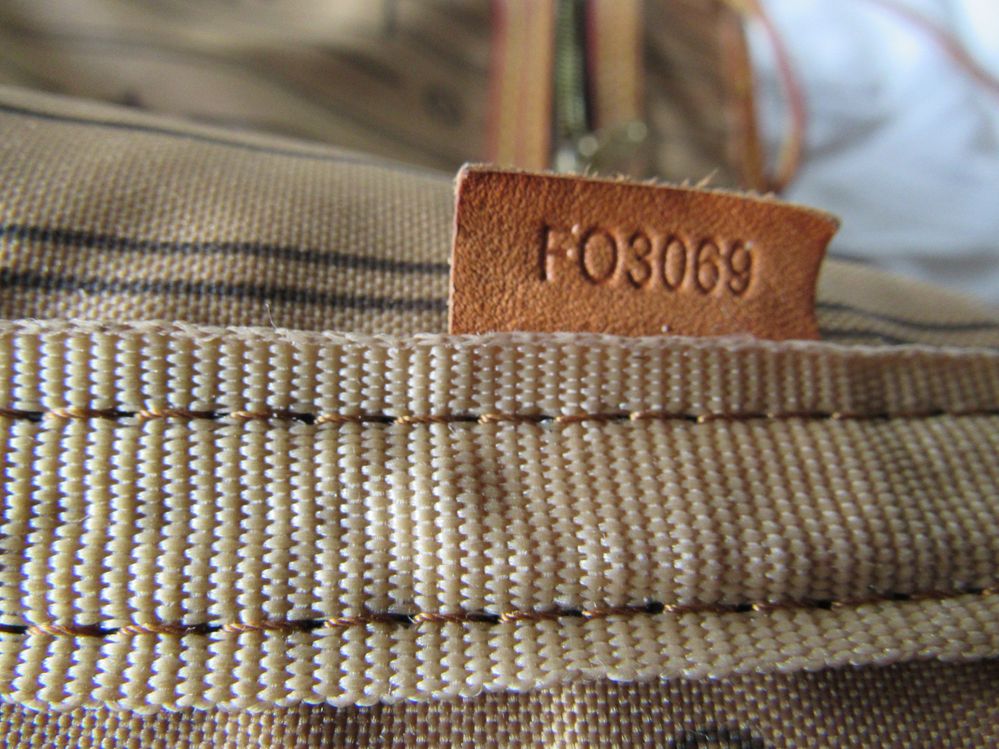 Tag sewn in side seam under tape as shown above