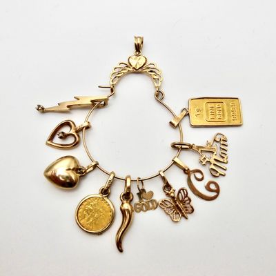Beverly Hills Gold Charm Holder w/ 10  charms from unknown sources.